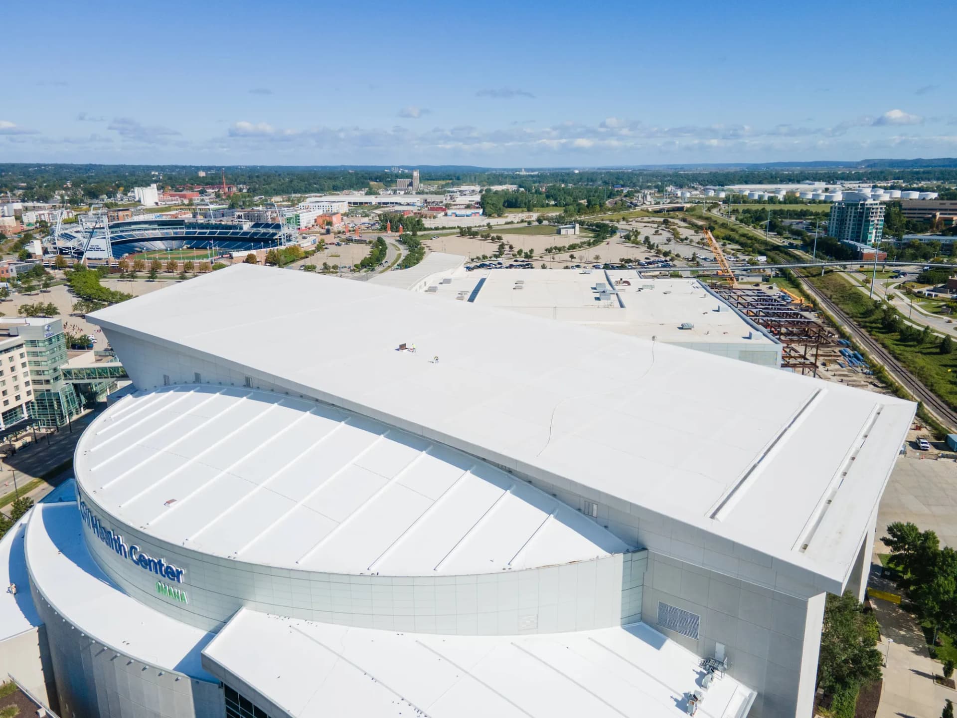 Aerial view of the white coated roof on the CHI Health Center in downtown Omaha