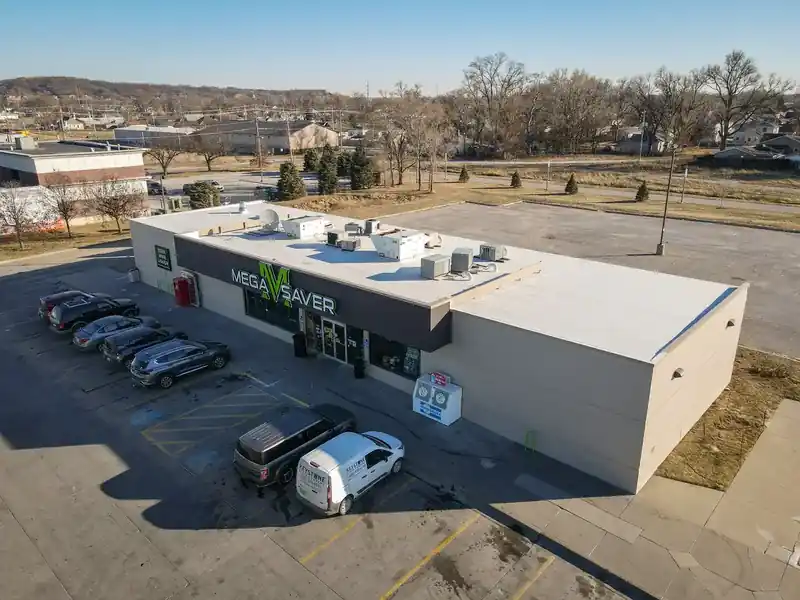 Low-slope commercial building in Omaha, NE with an Elevate single-ply flat roof system installed by Royalty Roofing