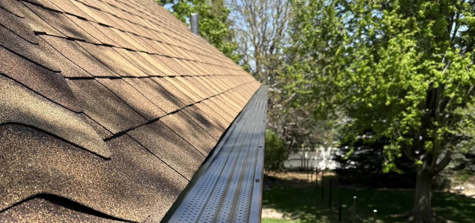 Gutters installation on Omaha home by Royalty Roofing and Siding