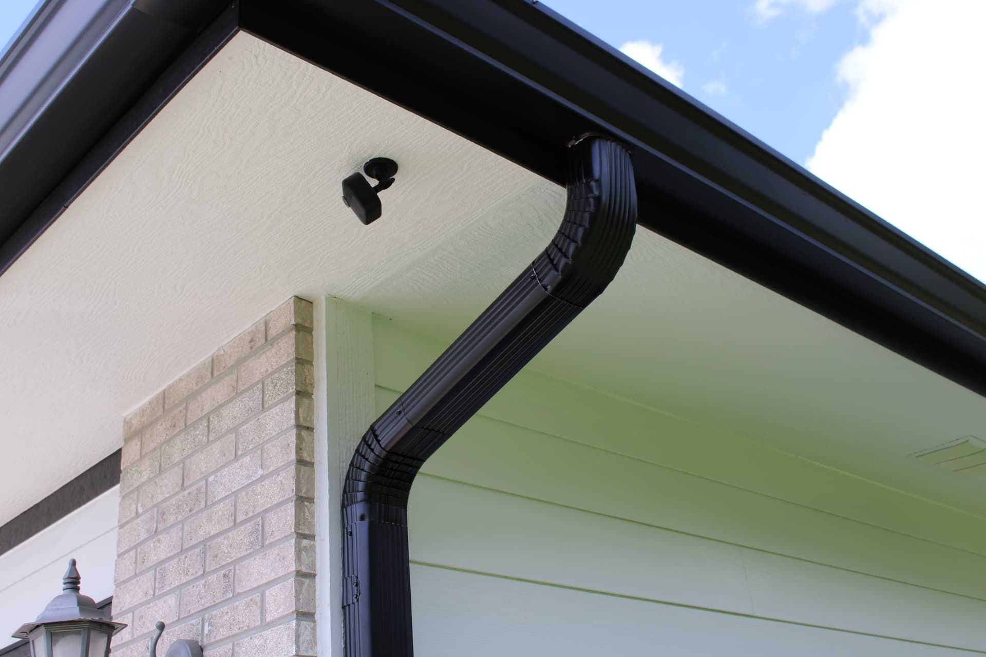 Seamless gutter installation on residential home in Omaha Nebraska by Royalty Roofing and Siding