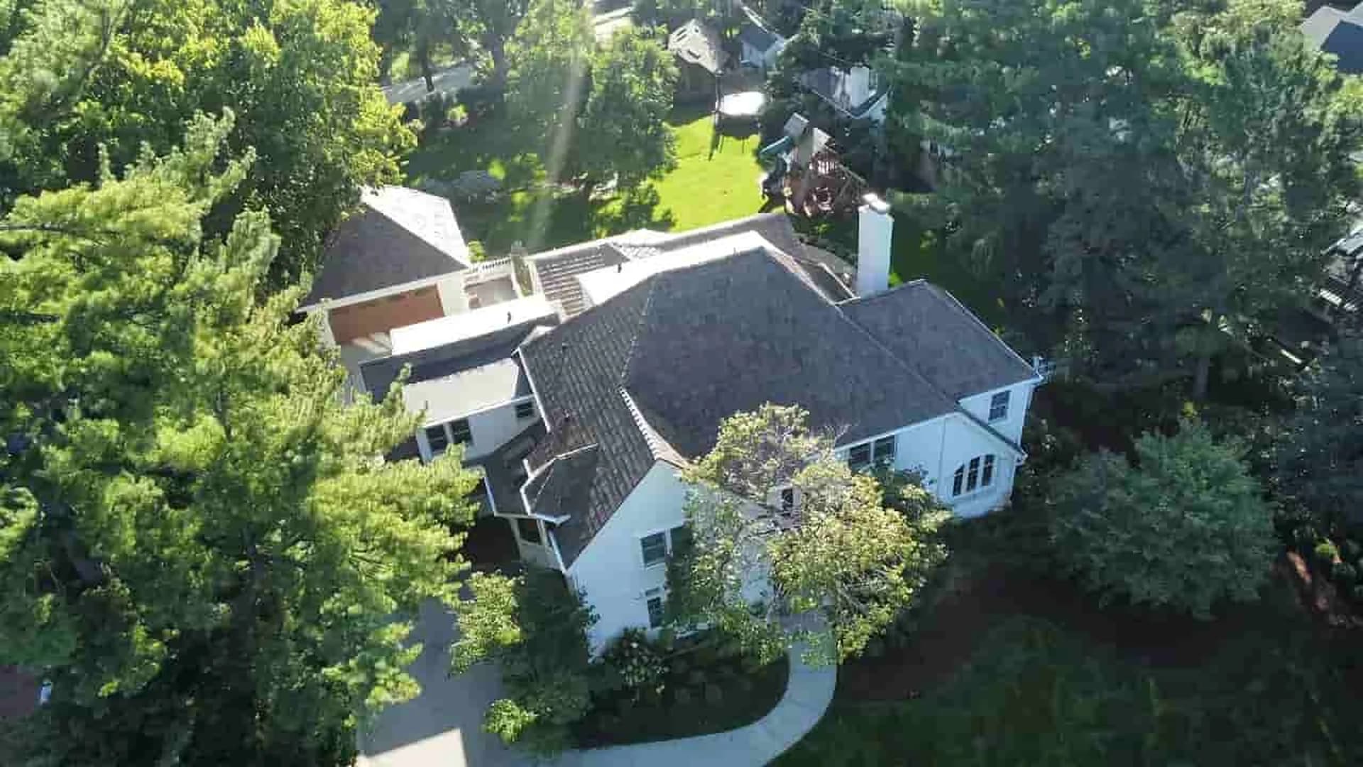 Roofing contractor in Omaha NE — Royalty Roofing and Siding aerial view of residential roof installation