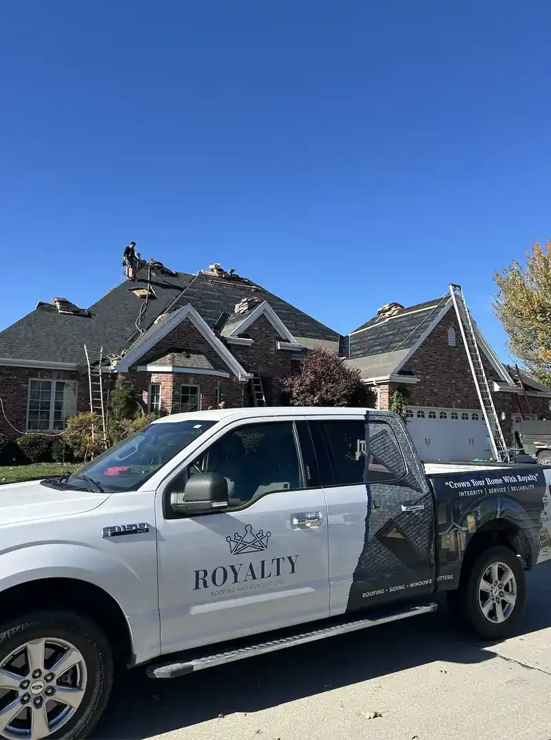 Royalty Roofing crew repairing storm damage on an Omaha home