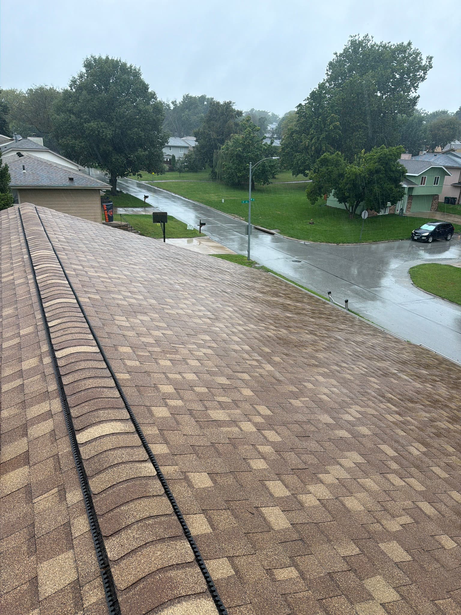 Ridge vent installed along the peak of an Omaha-area shingle roof by Royalty Roofing