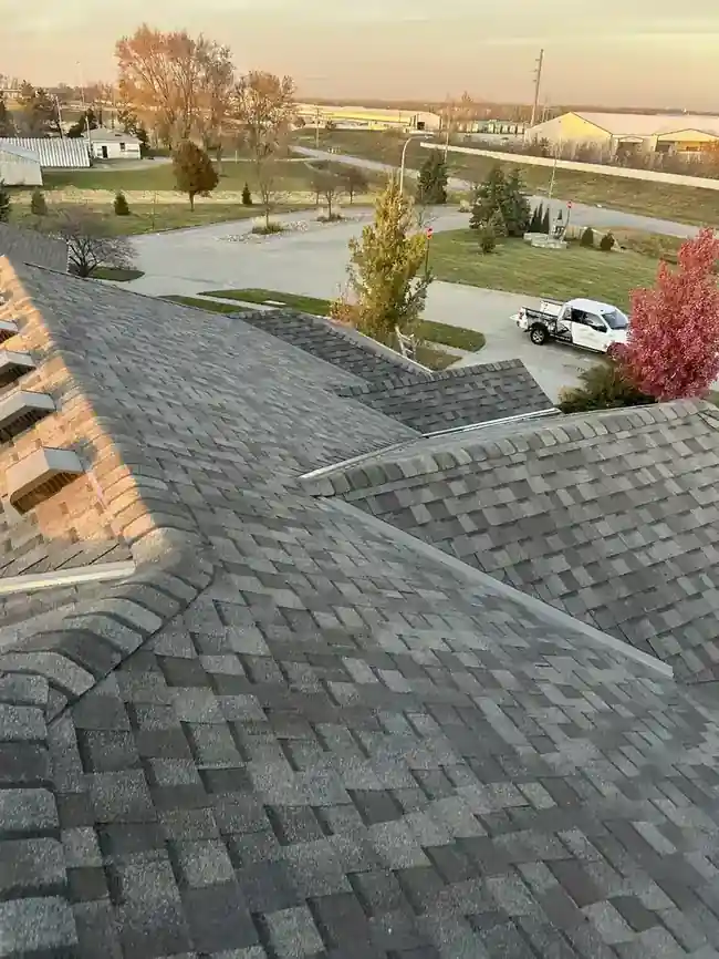 Dimensional asphalt shingle roof at sunset on an Omaha home