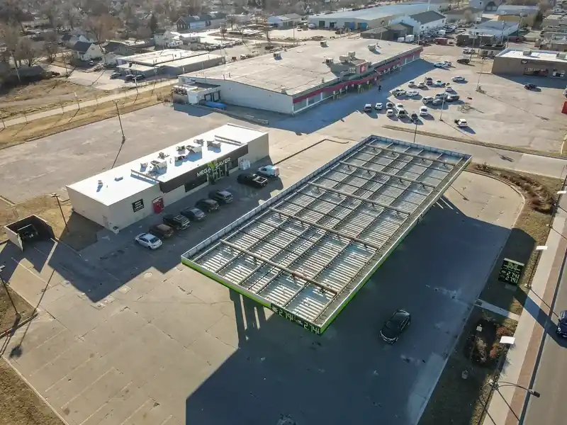 Aerial view of a metal canopy roof installed by Royalty Roofing