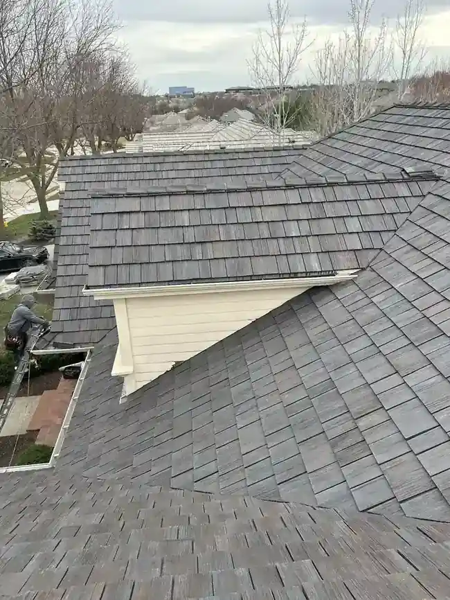 Close-up of DaVinci synthetic slate tiles being installed on an Omaha, NE home by Royalty Roofing