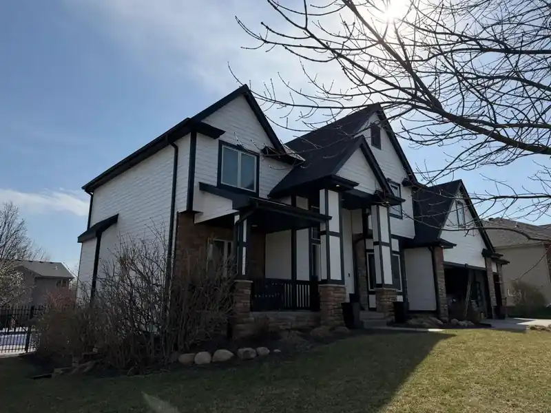 Tudor style home with professional roof inspection completed by Royalty Roofing in Omaha