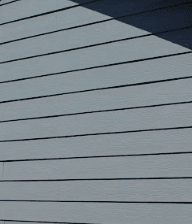 Close-up of gray-blue horizontal lap siding installed by Royalty Roofing and Siding